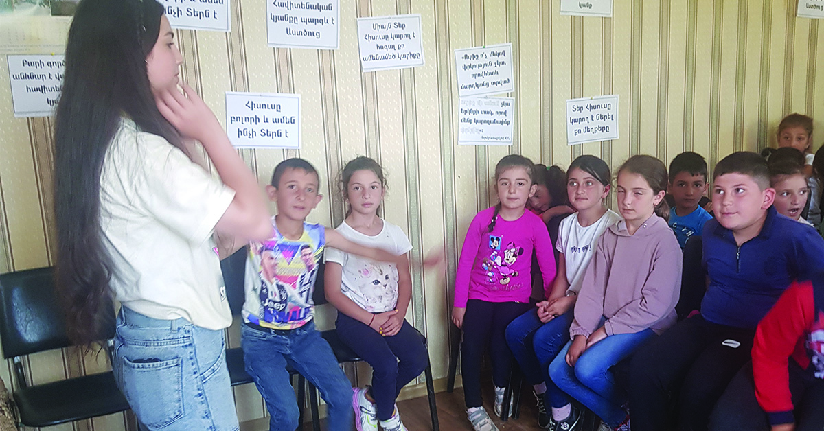 A female teacher conducting a class for children