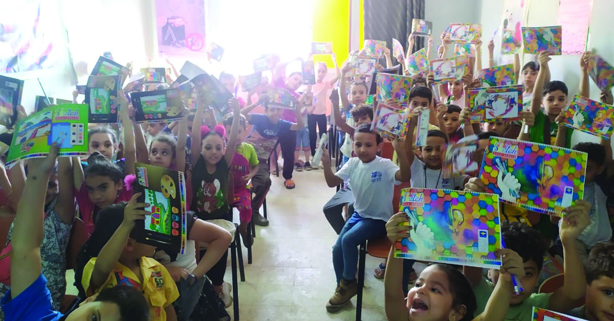 A classroom full of children posing for a picture