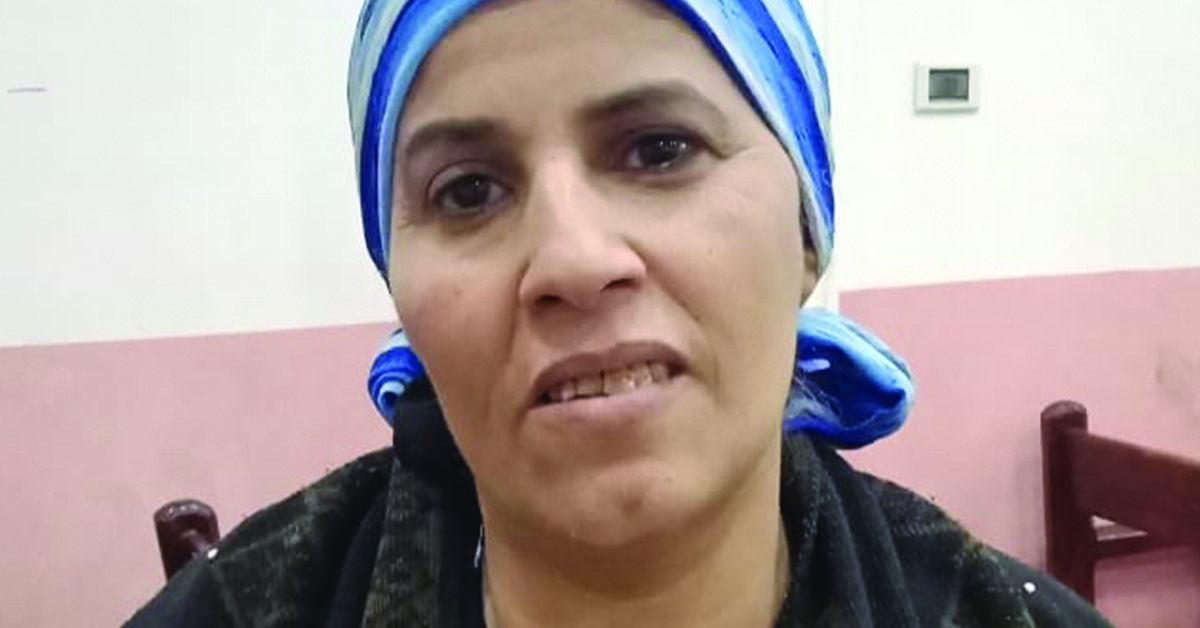 A profile headshot of Egyptian woman, Umm Hanna