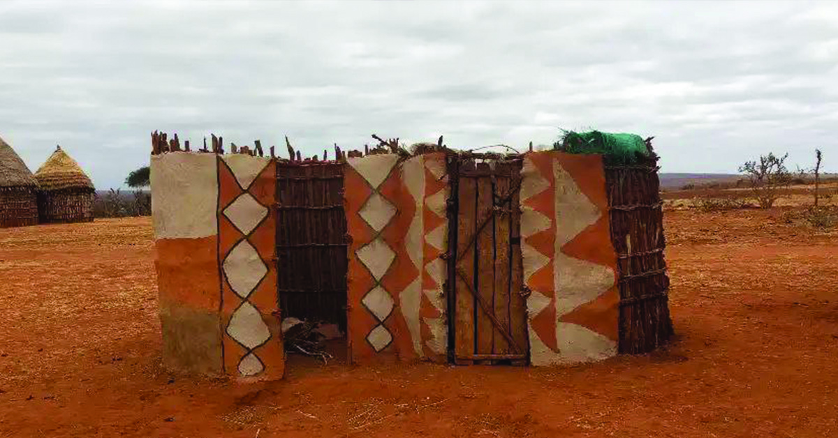 Two upright, rectangular bathroom stalls created by the villagers