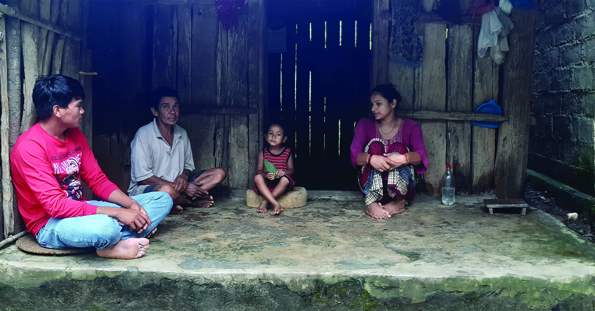 A TCD worker talking with a Nepal family.