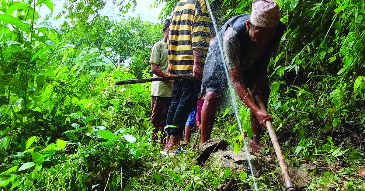 Villagers working on the water system in their village