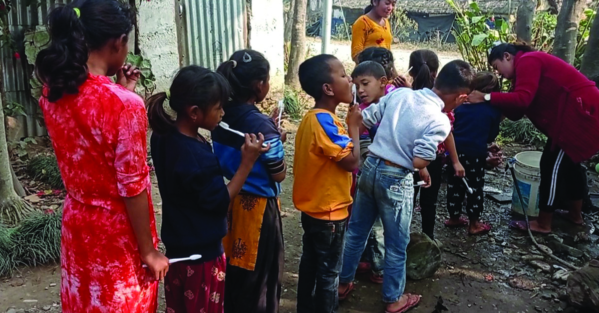 Children in line to use clean water.
