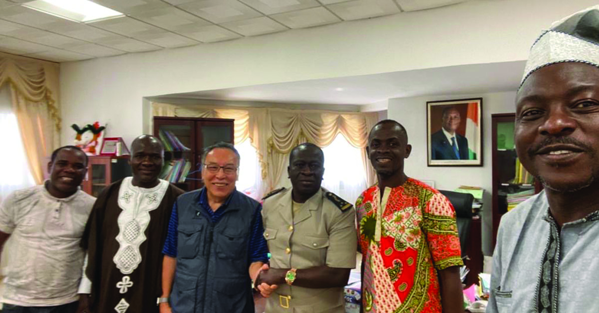 A group of Ivoire villagers with a local government authority and TCD supporter.