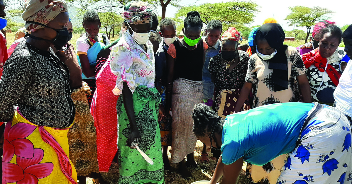 Kenyan villager, Buke, and her small business food stand