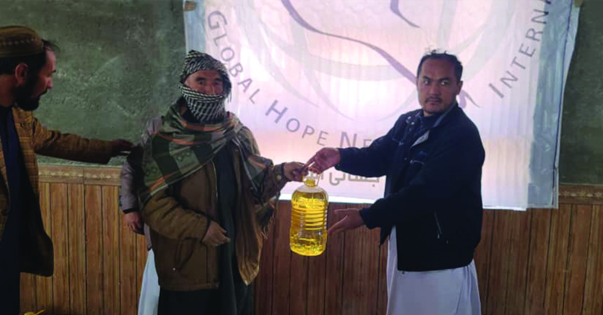 An Afghanistan native being given food relief