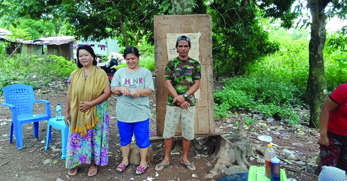 Three Income Generation Committee Leaders standing outdoors.