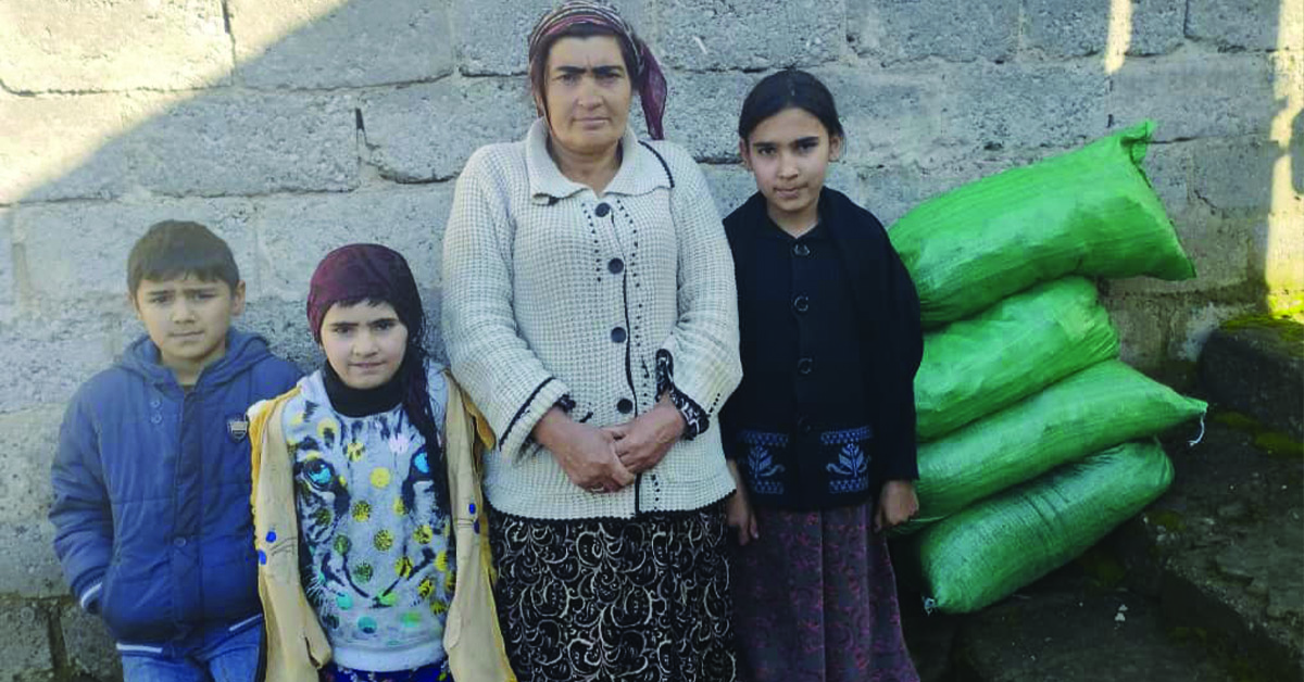 A Tajikistan mother and her three children.