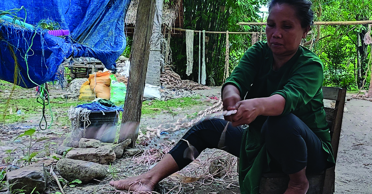 An Indonesian woman working on rope.