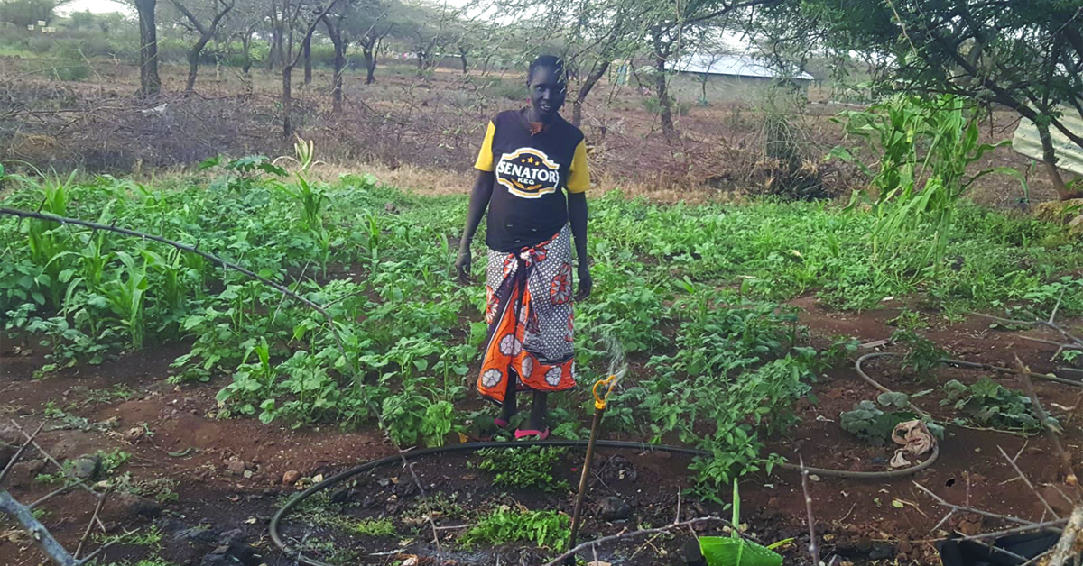 A farmer and her farmland.