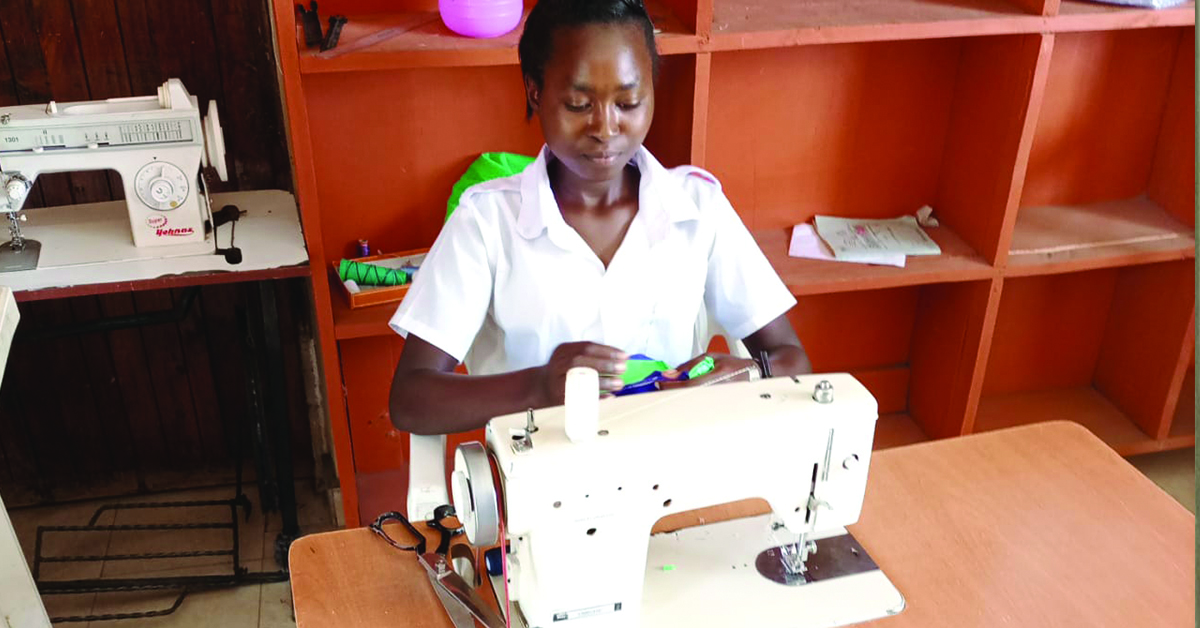 A Isiolo Empowerment student working with her sewing machine.