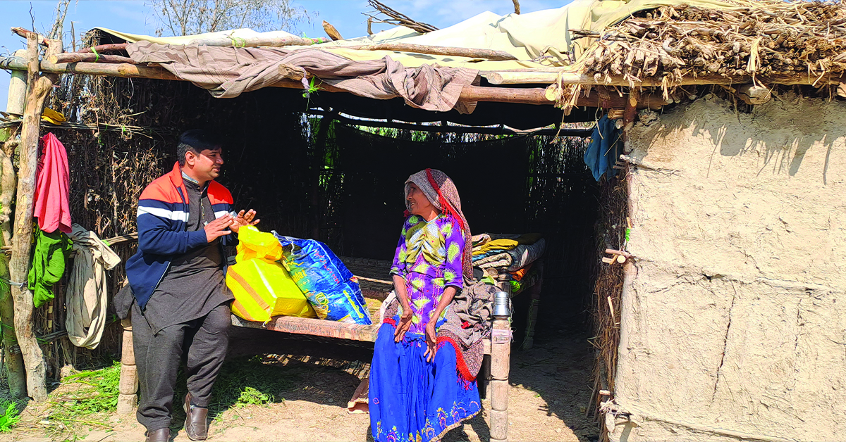 A villager and her home ruined by the flood.