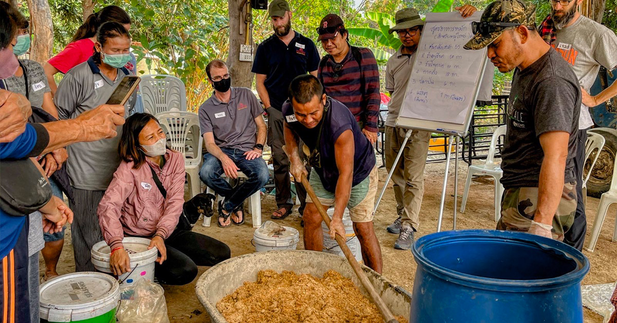 The Mae Pa Pai community seeing how to make nutritious pig feed.