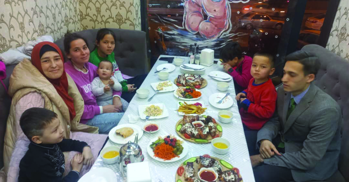 A vast table filled with family and food.