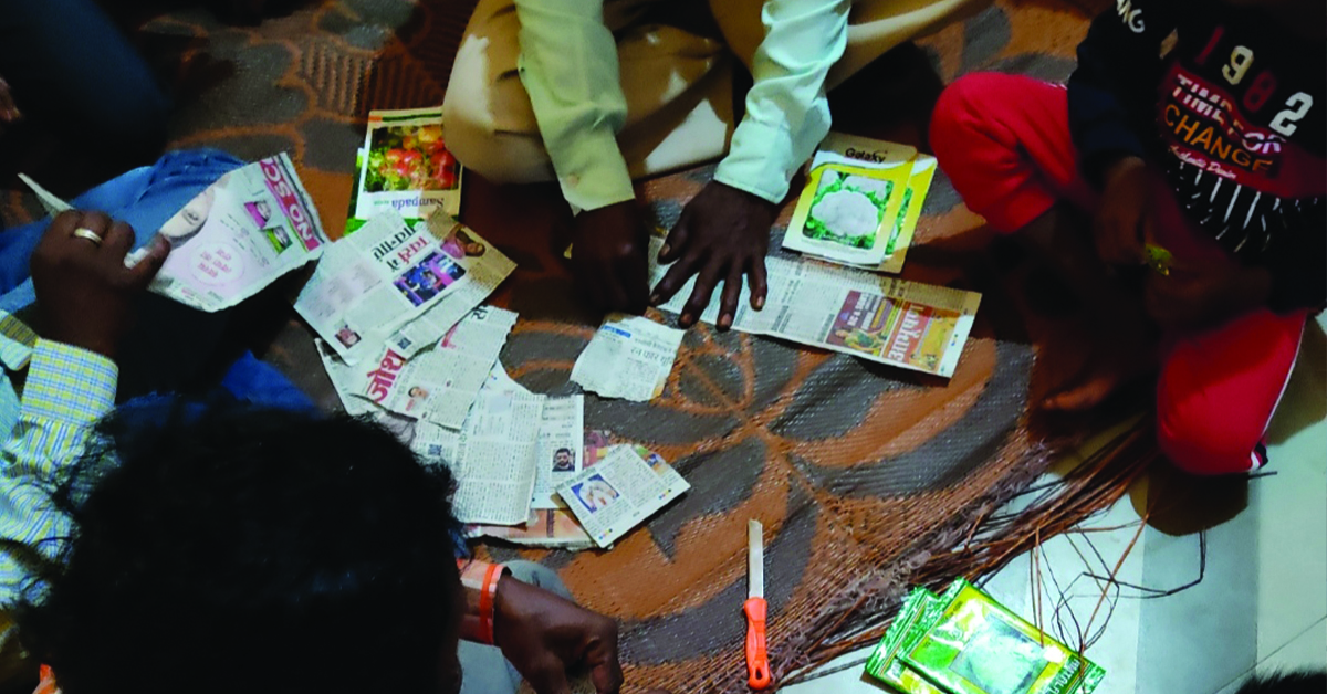 A table of locals distributing seeds.
