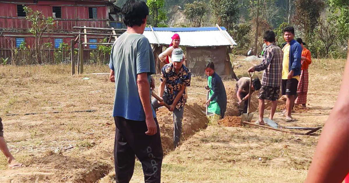 Nepal villagers working on the plumbing system for clean water.
