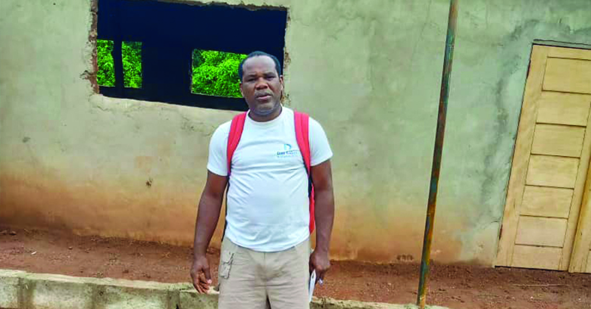 A Doko Villager in front of the school building.