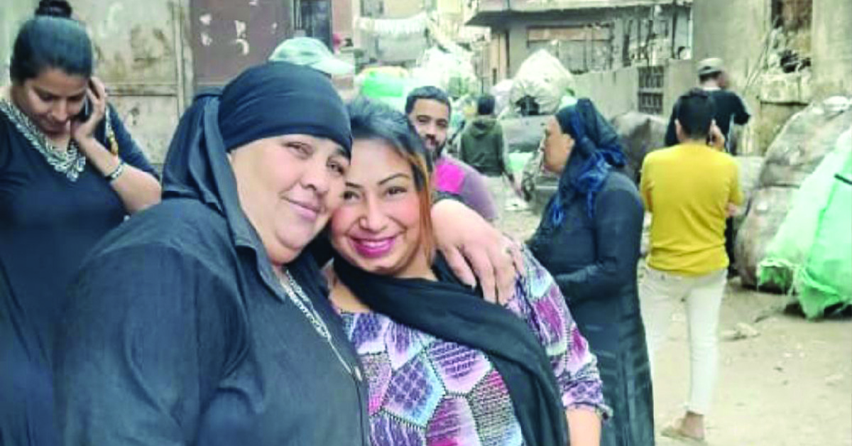 An Egyptian woman hugging TCD Worker.