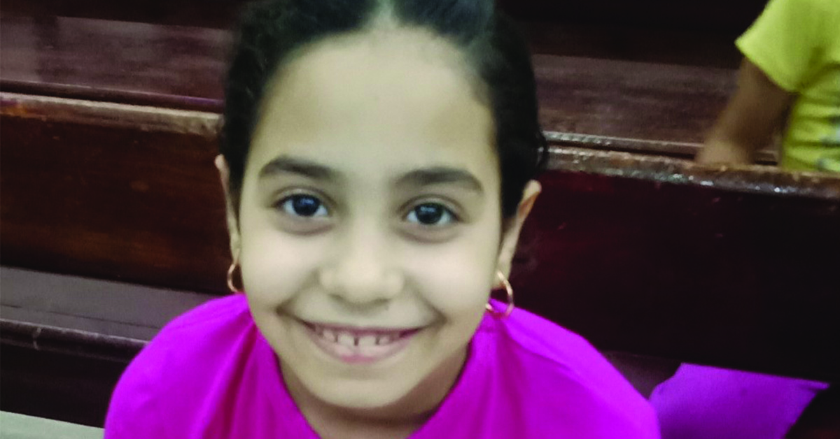 An Egyptian girl smiling.