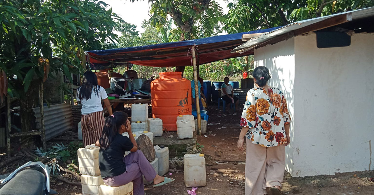 Indonesian villagers working to install a new water pump.