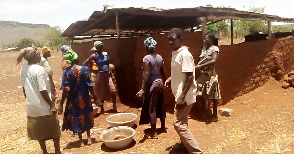 Togo villagers building their new meeting hall.