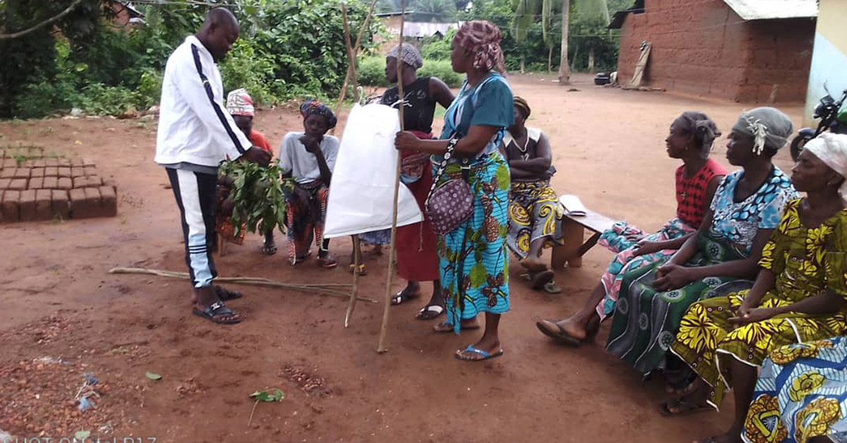 The Takon villagers learning how to make secure and proper waste bins.