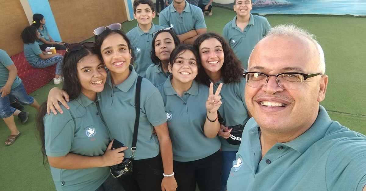 A TCD leader with a group of young teenagers that are the future leaders of TCD.