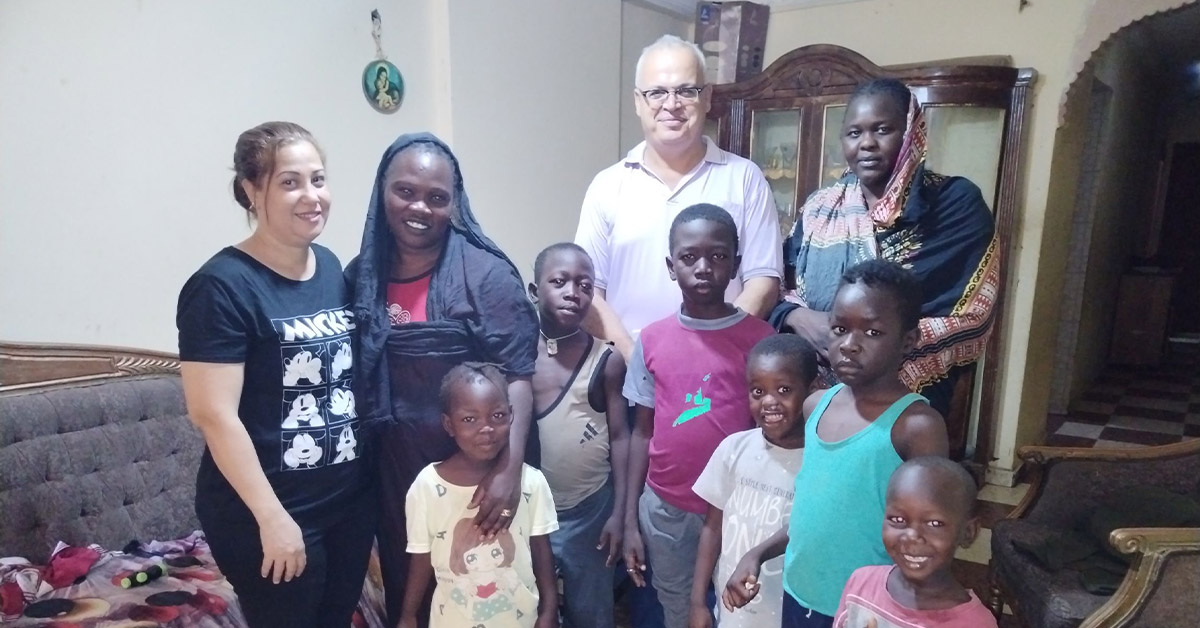 A group of Sudanese refugees with TCD leaders.