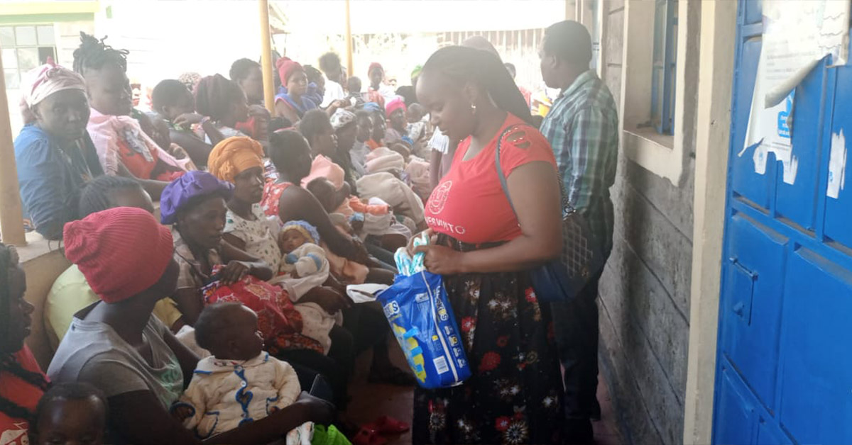 TCD workers supplying pregnant mothers with diapers.