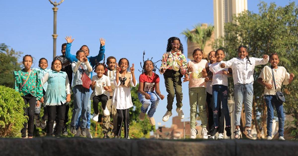 A group of children jumping for joy.