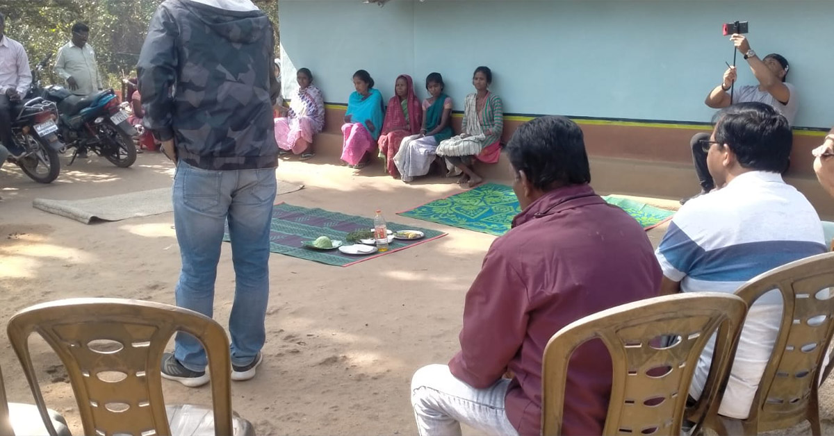 A small group of villagers from the Dhoker Jhara cluster listening to a wellness lesson.