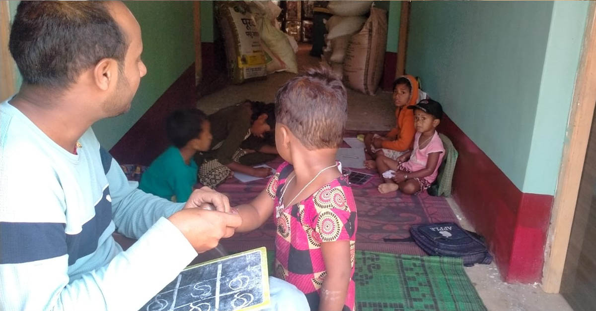 A teacher conducting class in his classroom.