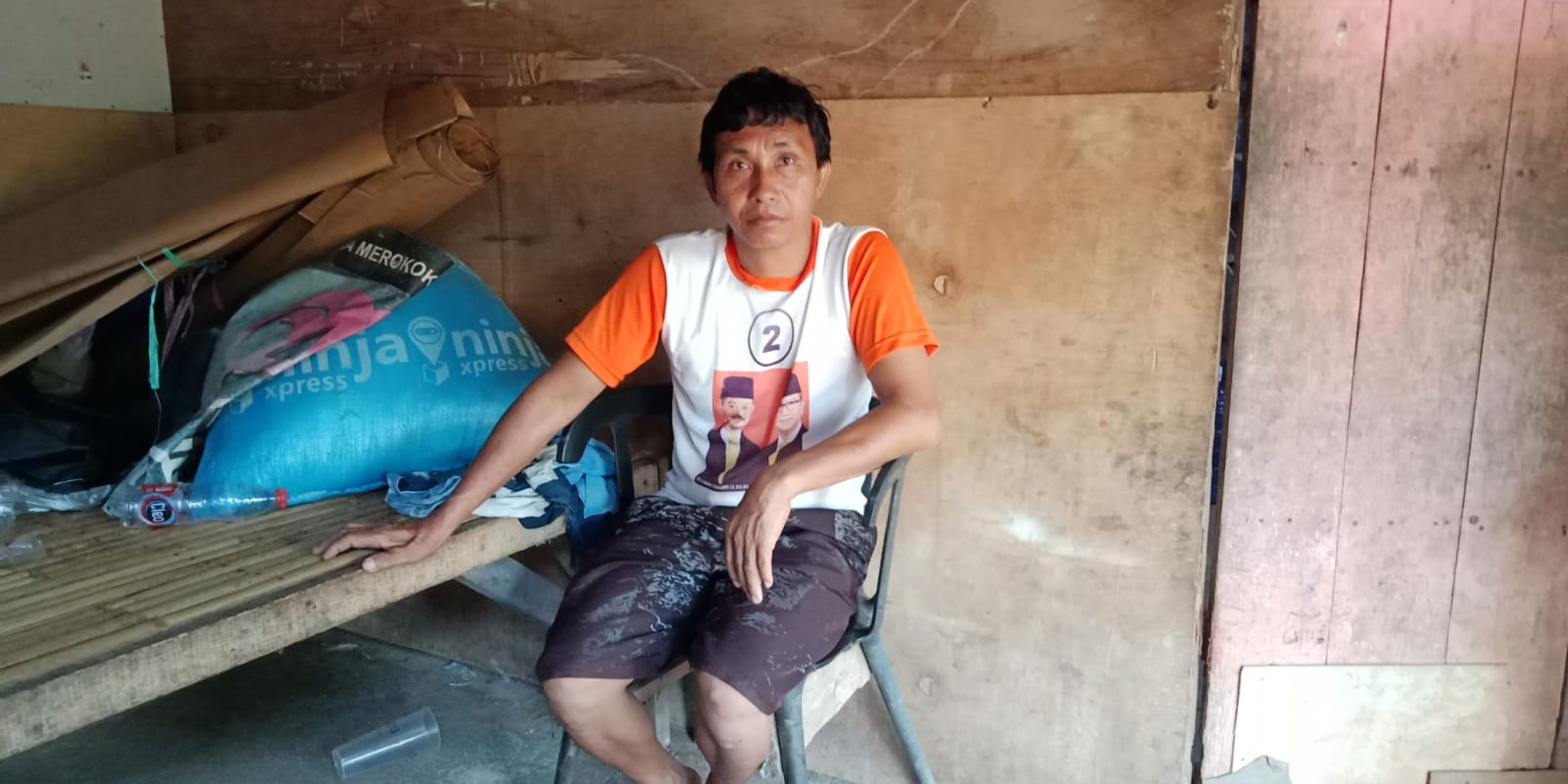 A sitting profile photo of Mawa villager, Natan.