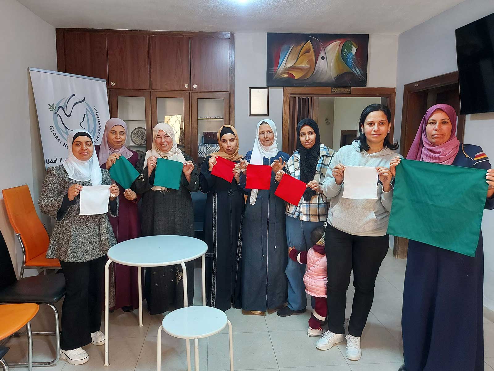 The House of Ruth students each holding their square sewing project.