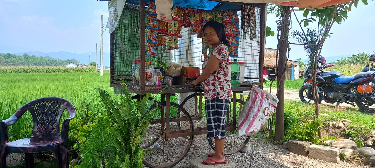 Ramantar villager, Anjana, with her small snack shop on wheels.