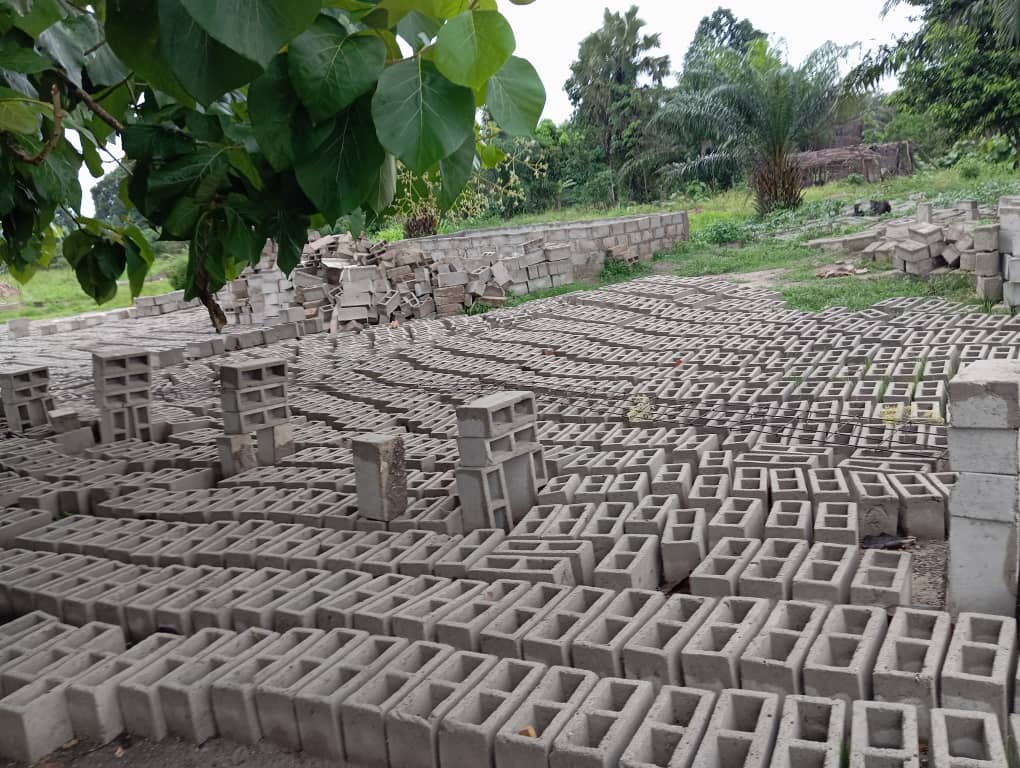 Many rows of concrete blocks that stretches far like a vegetable field.