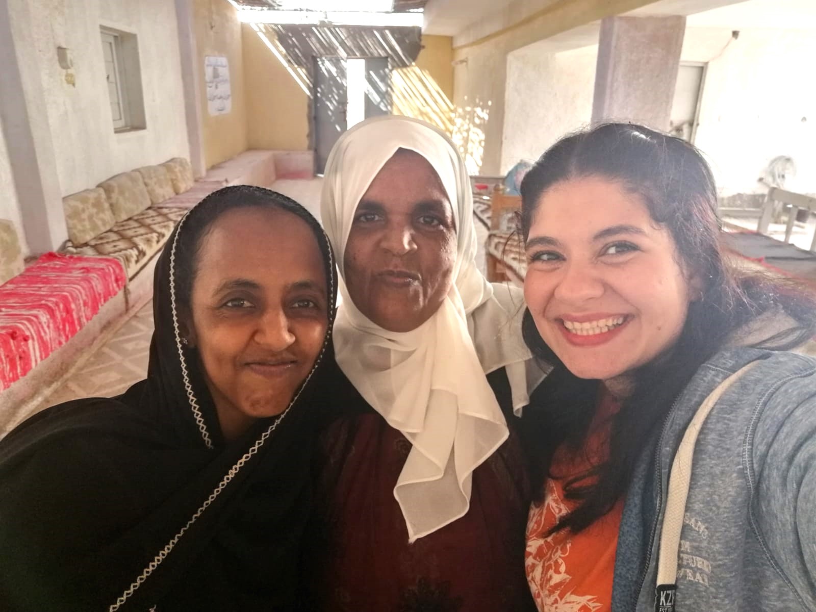 A TCD teacher with two of her adult students taking a selfie photo.