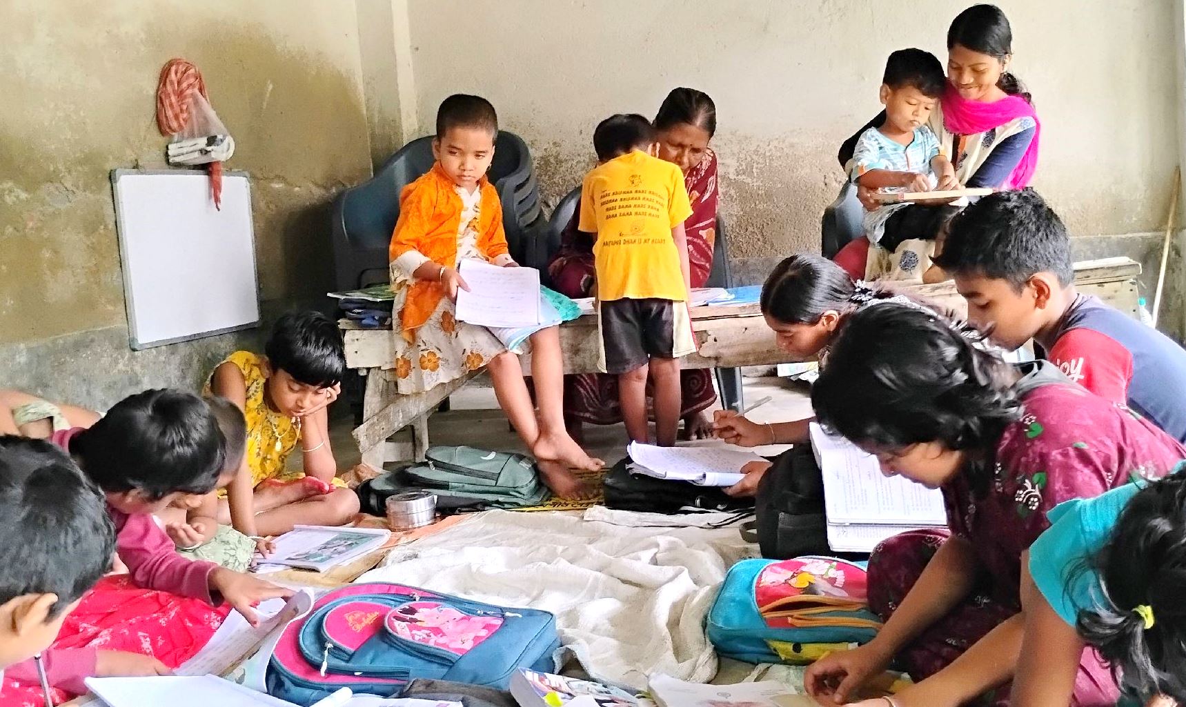 Binodpur children having a lesson indoors.