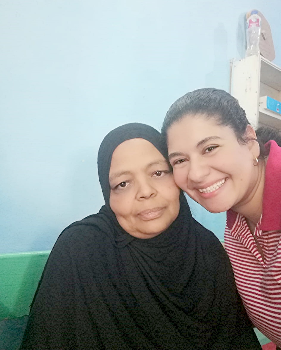 TCD participant, Umm Ashraqat, smiling with TCD worker, Sherine.