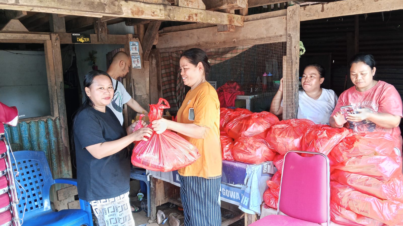 Mawa villagers showing the care package they received from TCD.