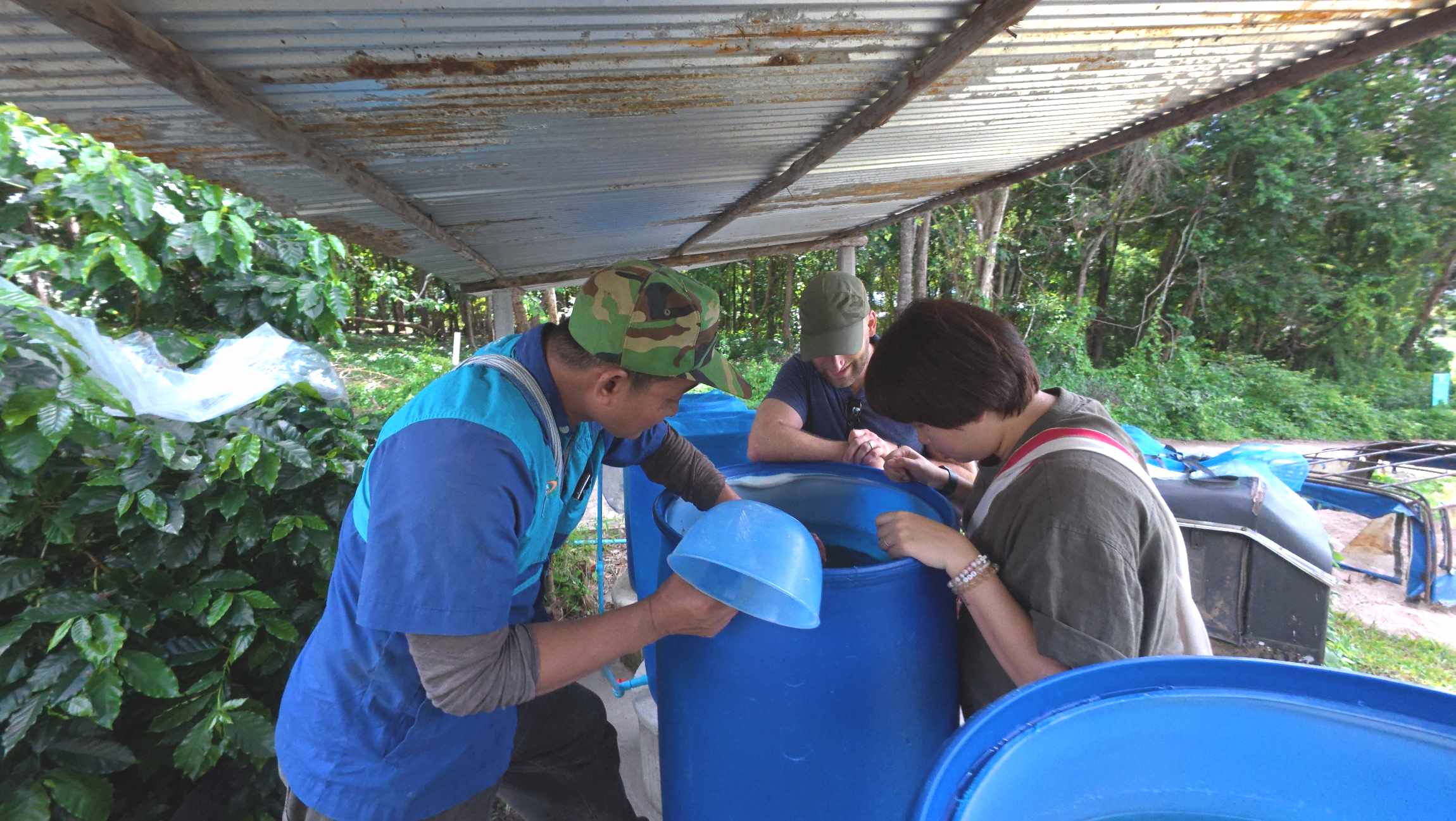 TCD at a Thailand village as they clean out water tanks together.
