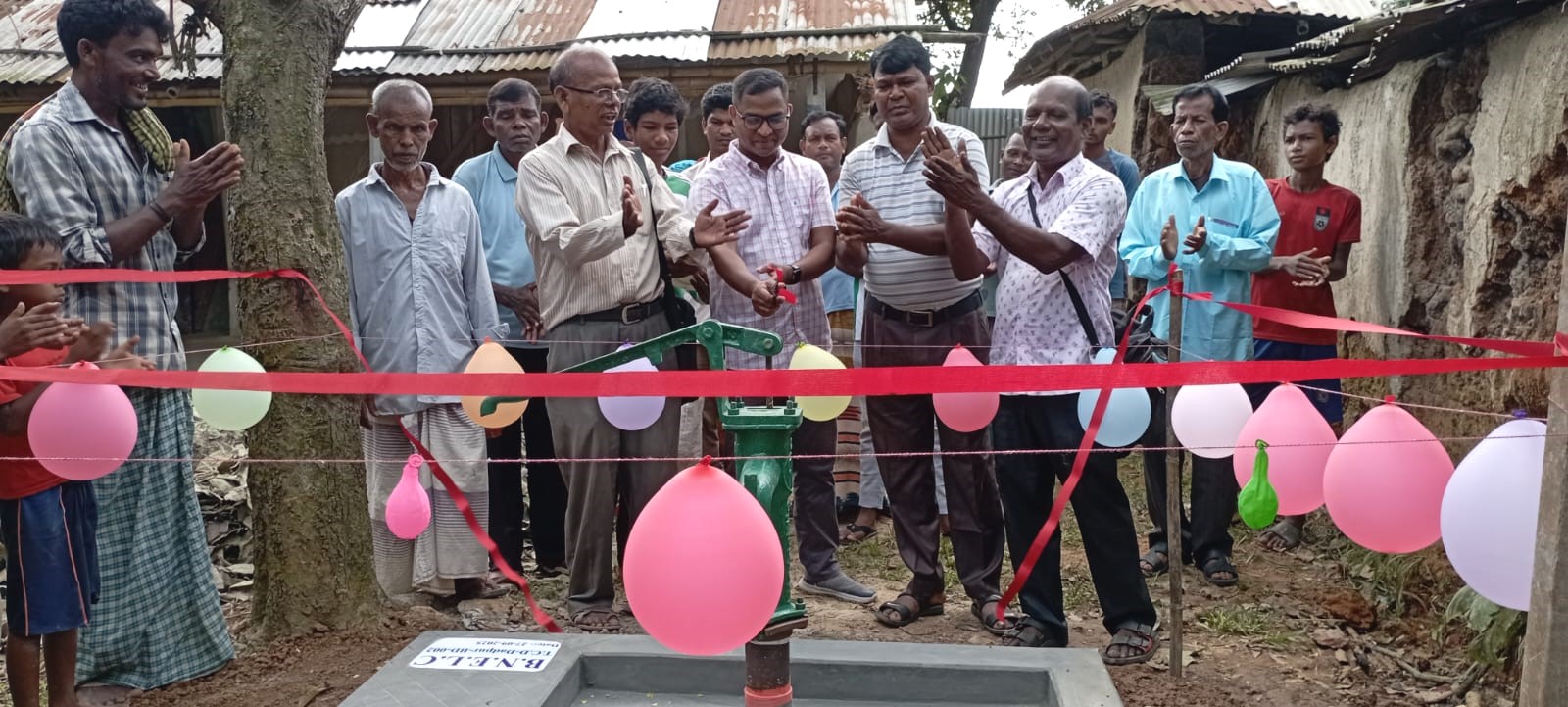 Dadpur villagers are having a ceremony as they clap for their new water pump.