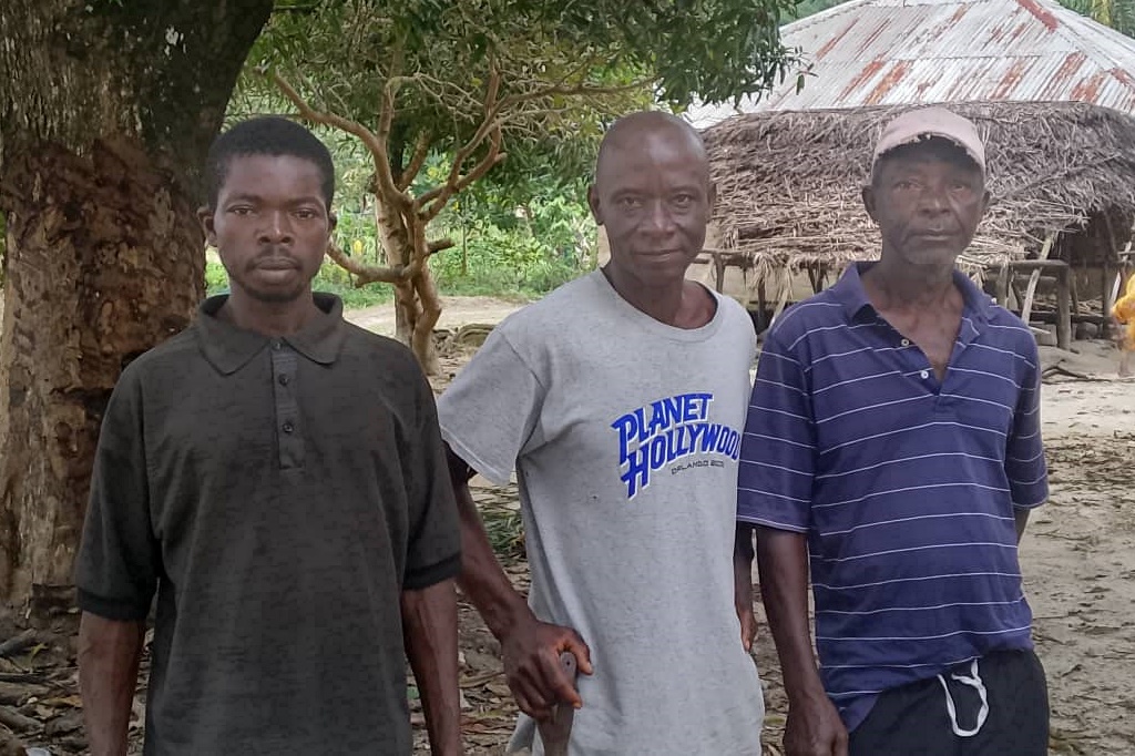 Three Komende farmers, Morie, Ansu, and John.