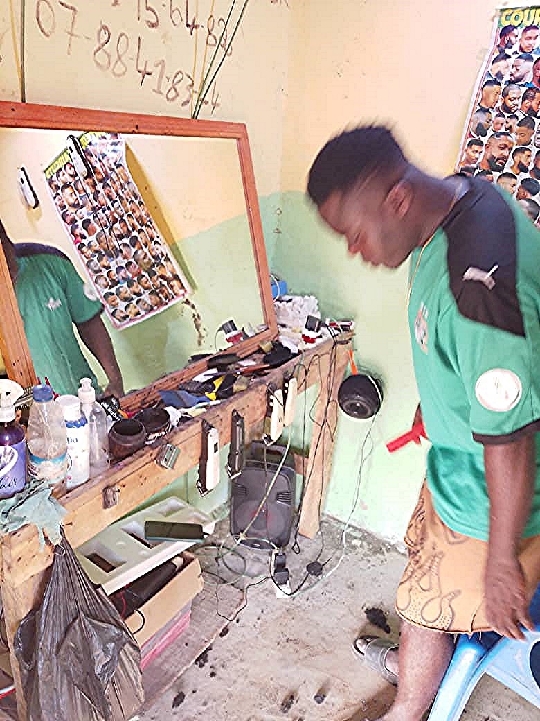 Attakasikoro villager, Kassi, and his barber room.