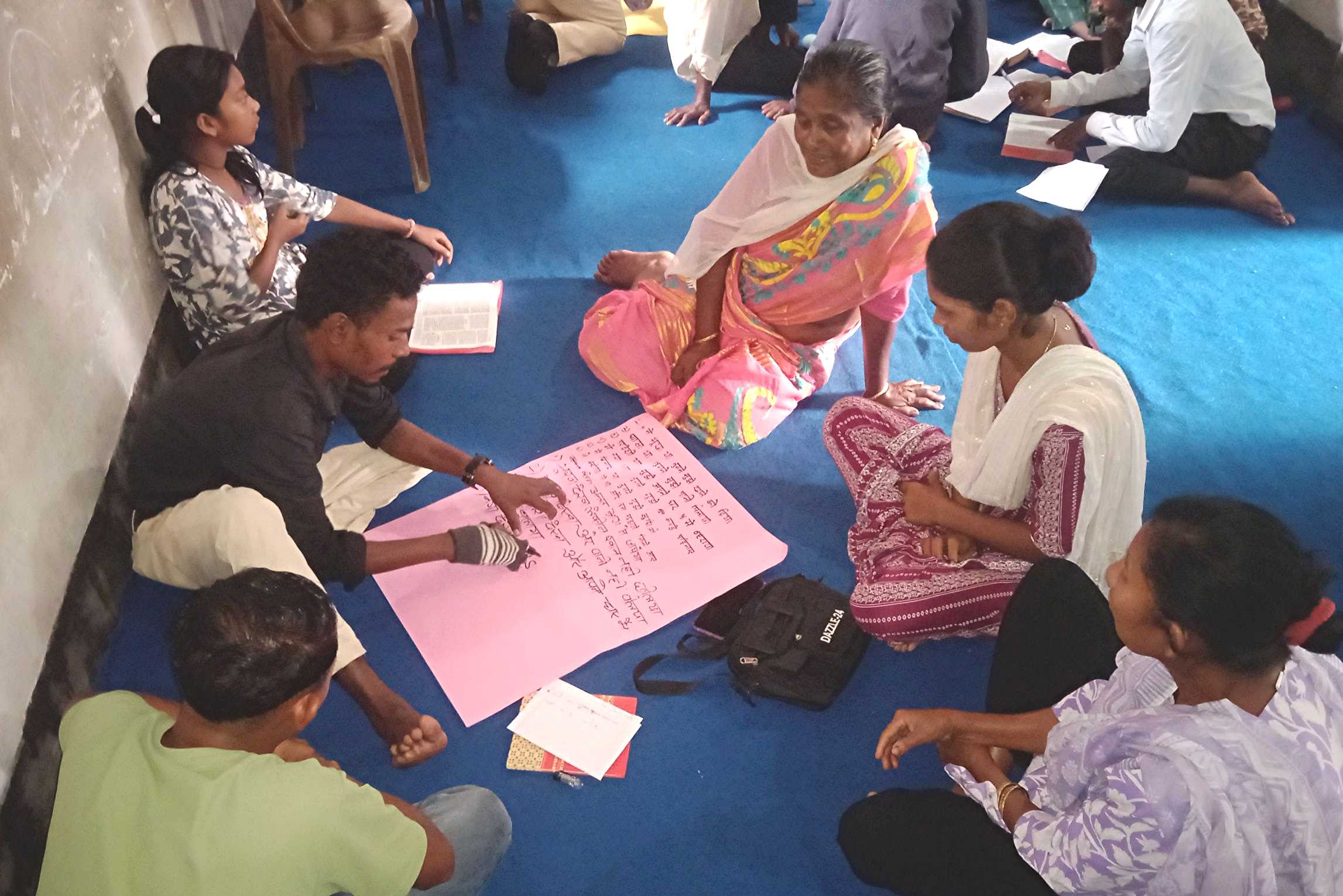 A 6-person learning session being conducted indoors at the West Bengal Cluster Expansion in India.