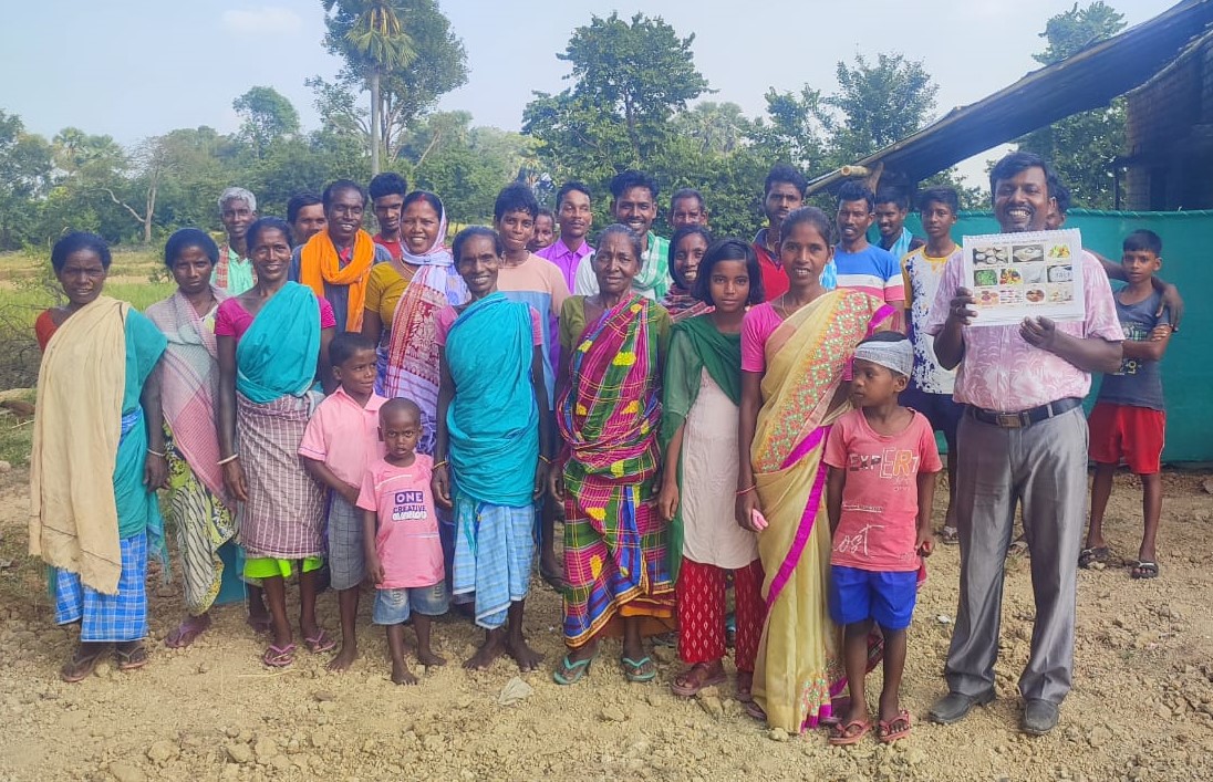 A large group photo of Baromasia villagers standing for a photo.