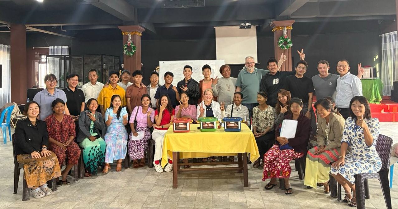 A formal, two-row group photo of the people of Myanmar.