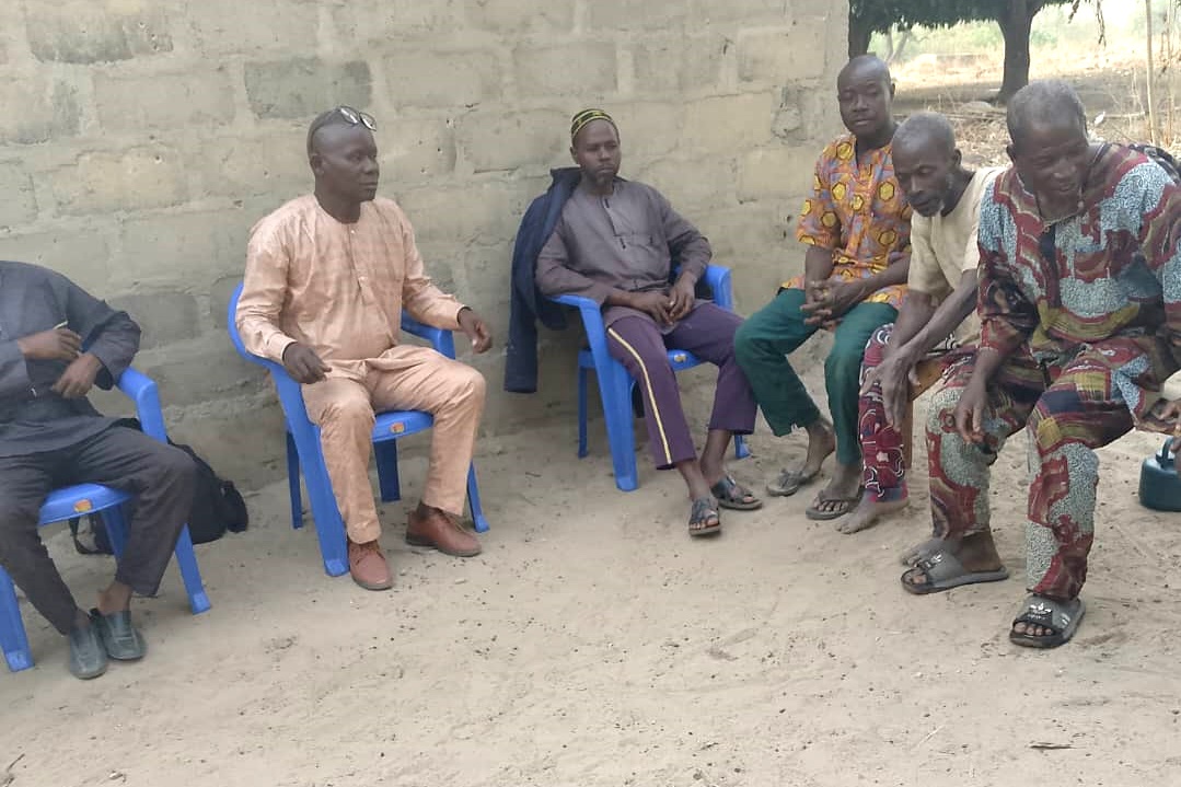 Six Yelivo men gathered together for a meeting.